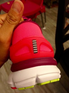 The small reflective band behind the heel.